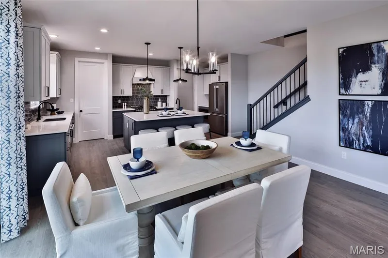 Dining area with dark wood finished floors, stairs, and recessed lighting — 0 Windsor @ Montage at Hawk Ridge, Lake St. Louis, MO 63367