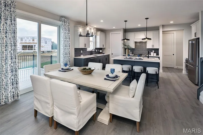 Dining space featuring wood finished floors, a water view, recessed lighting, and a chandelier — 0 Windsor @ Montage at Hawk Ridge, Lake St. Louis, MO 63367