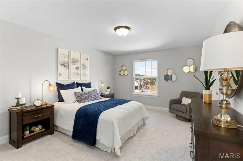 Bedroom with light carpet and baseboards — 2 Pin Oak at Hawk Ridge Estate, Lake St. Louis, MO 63367