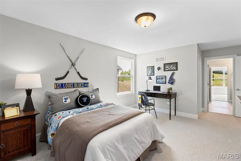 Bedroom with light carpet and a desk — 2 Pin Oak at Hawk Ridge Estate, Lake St. Louis, MO 63367