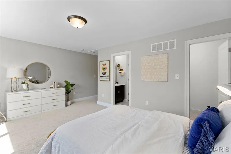 Bedroom with light carpet and ensuite bath — 2 Pin Oak at Hawk Ridge Estate, Lake St. Louis, MO 63367