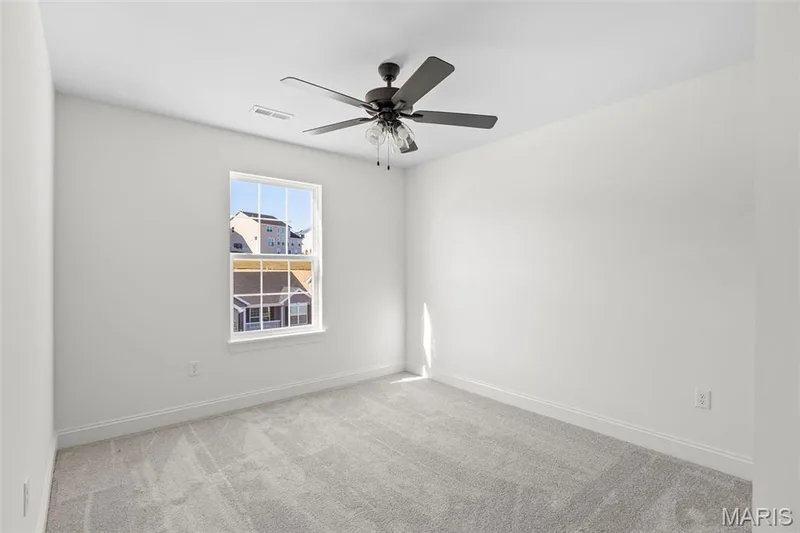 Carpeted empty room with baseboards and a ceiling fan — 2 Sequoia at Hawk Ridge Estate, Lake St. Louis, MO 63367