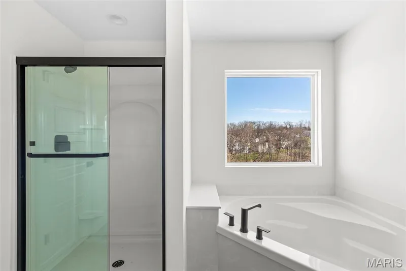 Bathroom with a stall shower and a garden tub — 2 Sequoia at Hawk Ridge Estate, Lake St. Louis, MO 63367