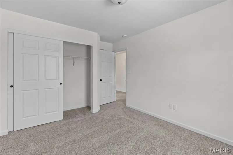 Unfurnished bedroom with carpet and a closet — 563 Edison Way, Wentzville, MO 63385
