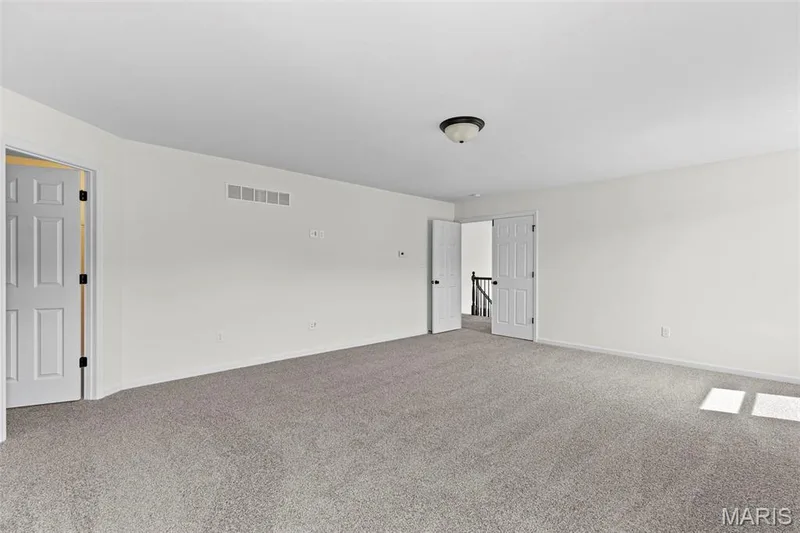 Carpeted spare room with baseboards — 563 Edison Way, Wentzville, MO 63385