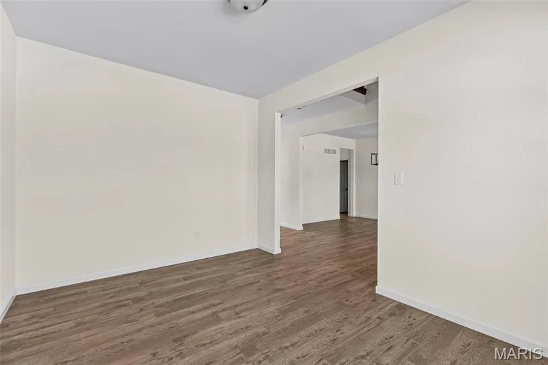 Spare room featuring wood finished floors and baseboards — 563 Edison Way, Wentzville, MO 63385
