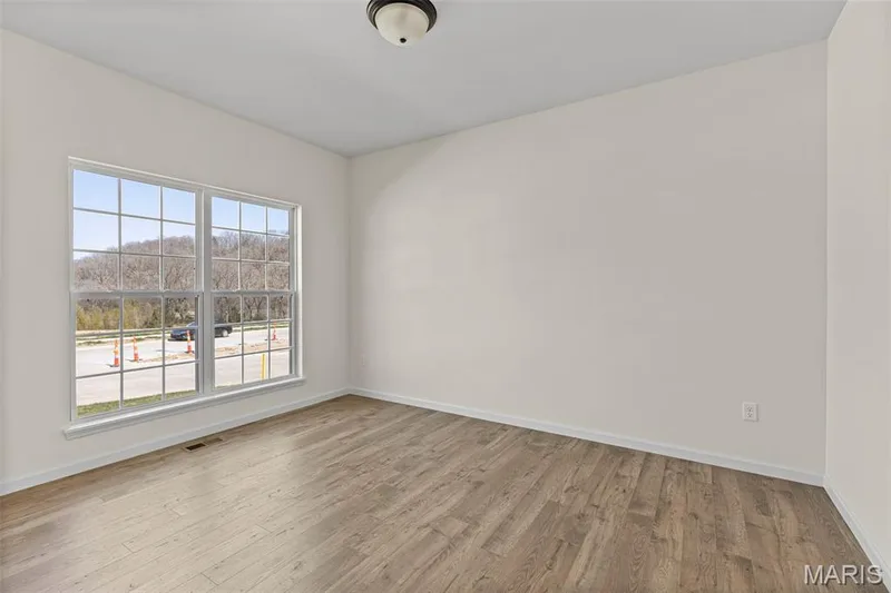 Spare room with light wood-style floors — 563 Edison Way, Wentzville, MO 63385