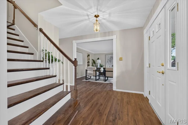 The home welcomes you with brand-new flooring stretching across every room! — 14529 Brittania Drive, Chesterfield, MO 63017