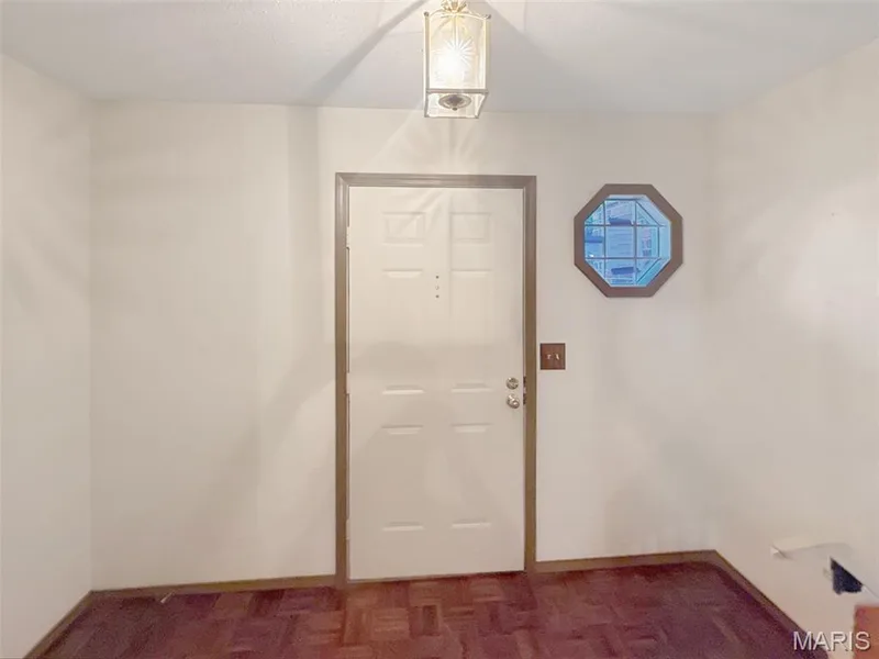 Entryway with baseboards — 312 Crown Colony Court #F, St Peters, MO 63376