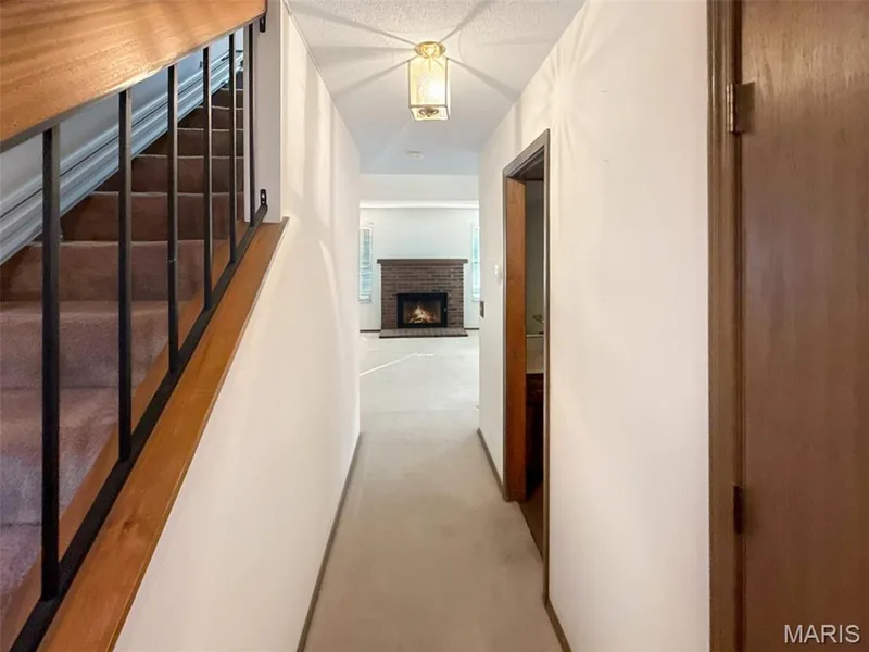 Hallway with stairs — 312 Crown Colony Court #F, St Peters, MO 63376
