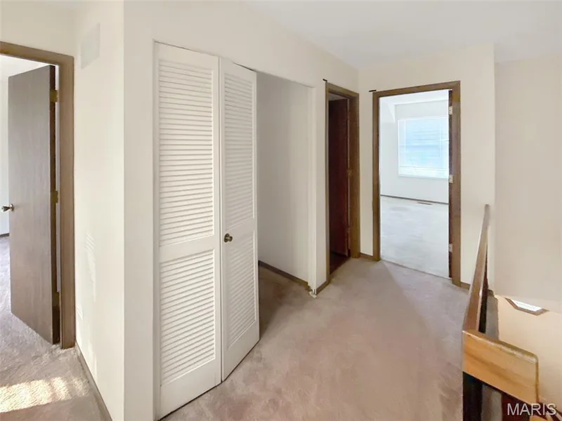Hall with light colored carpet — 312 Crown Colony Court #F, St Peters, MO 63376