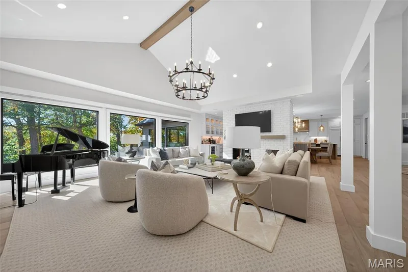 Vaulted great room with gas fireplace and lake views. — 22 Holloway Drive, Lake St. Louis, MO 63367