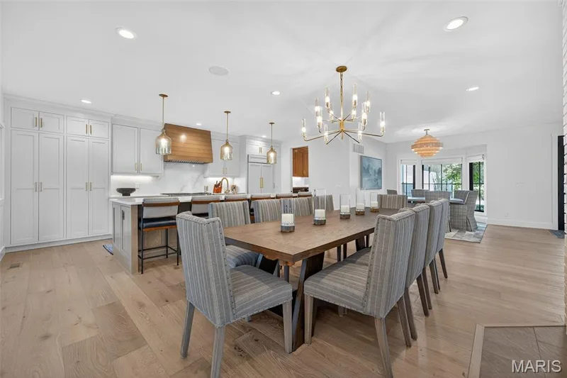 Large eat in kitchen with gas fireplace, sub zero appliances, wolf gas range, and 2 dishwashers.  This space is ready for hosting! — 22 Holloway Drive, Lake St. Louis, MO 63367