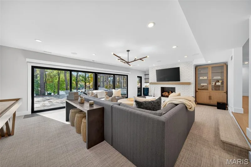 Lower level family room with gas fireplace and wet bar. — 22 Holloway Drive, Lake St. Louis, MO 63367