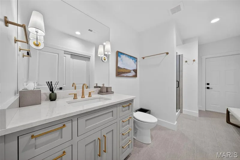 Lower level full bathroom with access inside and out. — 22 Holloway Drive, Lake St. Louis, MO 63367