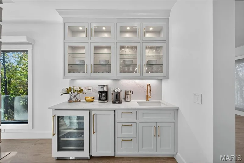 Wet bar with ice maker & beverage cooler just off the kitchen and great room — 22 Holloway Drive, Lake St. Louis, MO 63367