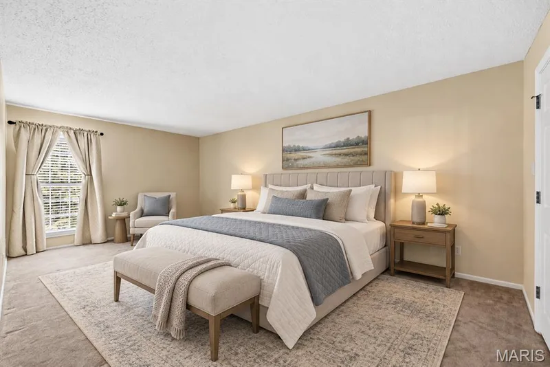 Carpeted flooring, window with blinds, neutral wall paint, and a textured ceiling — 14443 Bantry Lane #16, Chesterfield, MO 63017