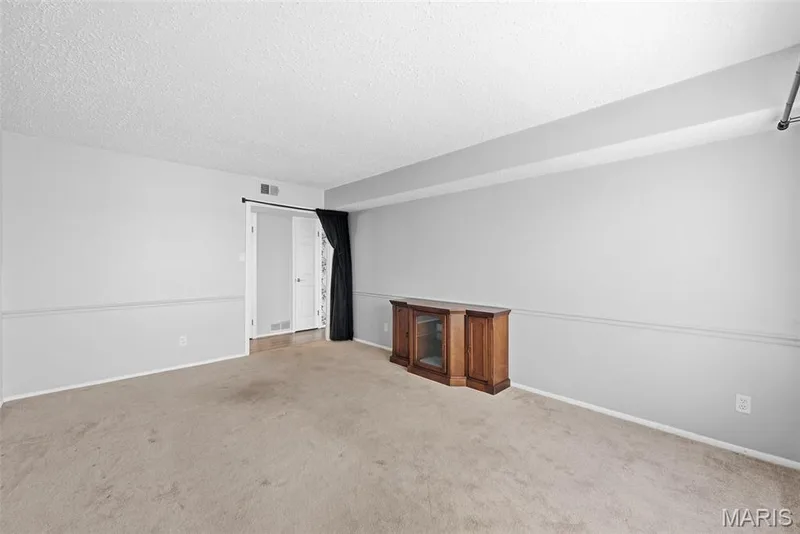 Recessed lighting, neutral paint palette, and textured ceiling — 14443 Bantry Lane #16, Chesterfield, MO 63017