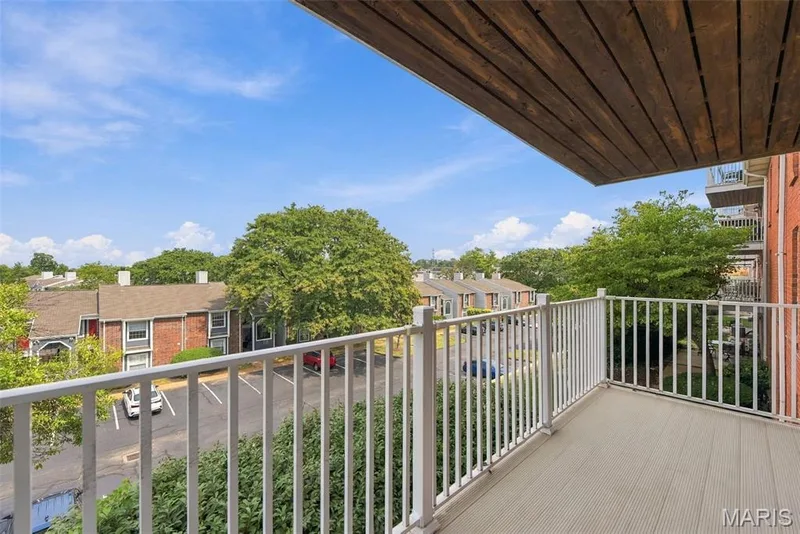 Private balcony featuring composite decking and a white railing — 14443 Bantry Lane #16, Chesterfield, MO 63017