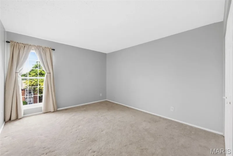 Neutral wall tones with a window providing natural illumination — 14443 Bantry Lane #16, Chesterfield, MO 63017