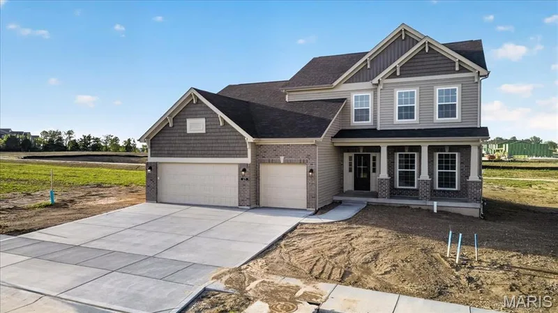 The Bridgeport expanded plan -elevation 8 by Consort Homes with 12x20 patio, 8 ft Ingrade foundation and 3 car garage — 125 Sterling Drive, Lake St. Louis, MO 63367