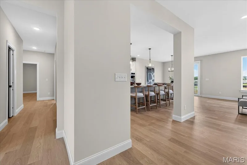 Hallway with a view of the kitchen — 125 Sterling Drive, Lake St. Louis, MO 63367