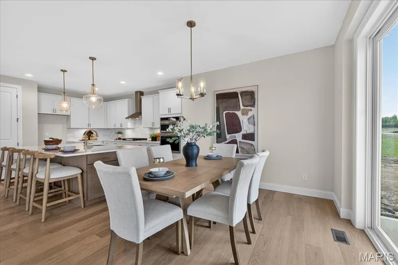 Breakfast area with view of kitchen — 125 Sterling Drive, Lake St. Louis, MO 63367