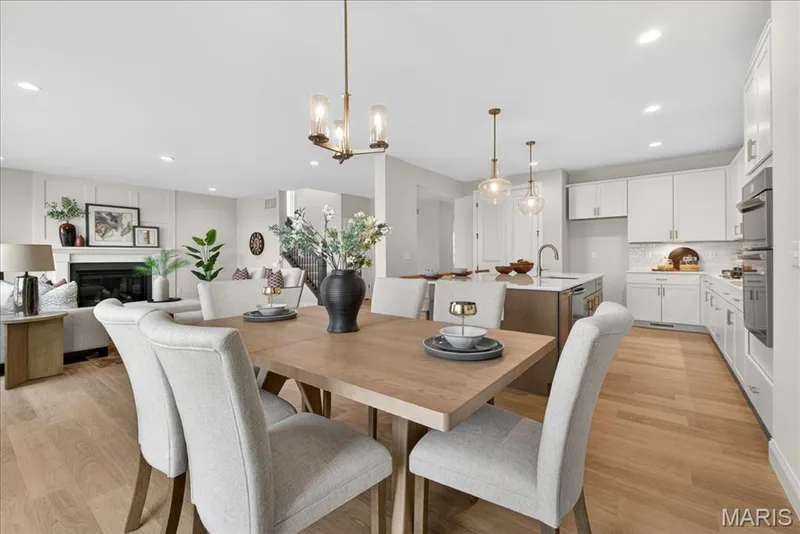 Breakfast area with view of kitchen and family room — 125 Sterling Drive, Lake St. Louis, MO 63367