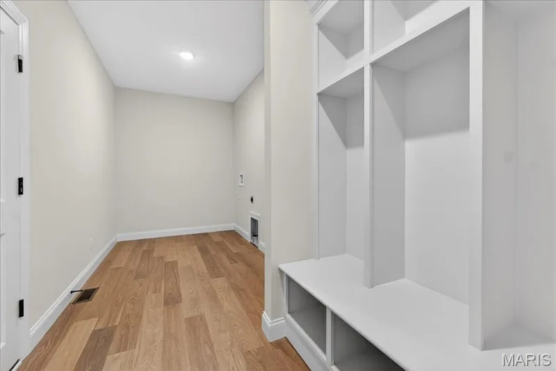Laundry room with cubbies and boot bench — 125 Sterling Drive, Lake St. Louis, MO 63367