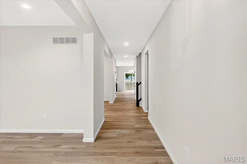 Hallway with recessed lighting and light wood-style floors — 210 Randlin Drive, O'Fallon, MO 63367