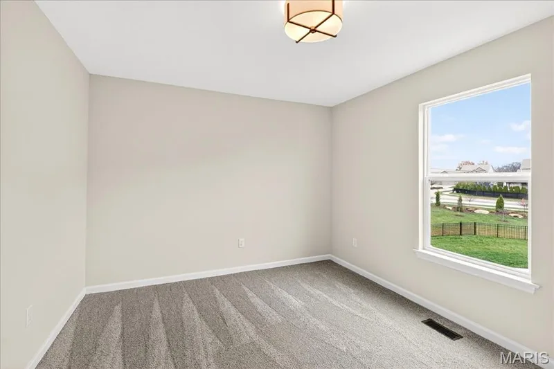 Bedroom with carpet and baseboards — 210 Randlin Drive, O'Fallon, MO 63367