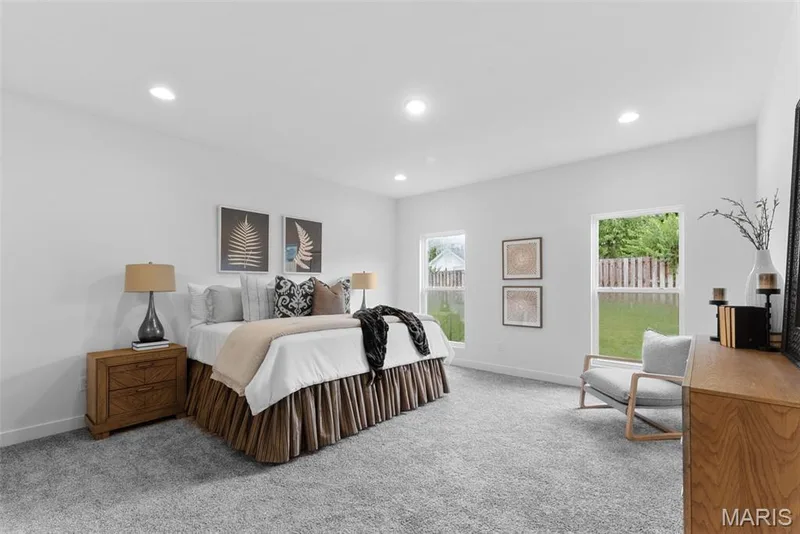 Bedroom featuring light colored carpet, recessed lighting, and multiple windows — 1 TBB Rochester @ Kreder Farms, St Charles, MO 63304