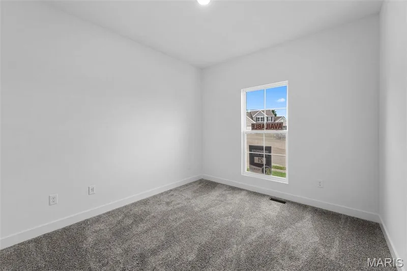 Spare room featuring carpet and baseboards — 1 TBB Rochester @ Kreder Farms, St Charles, MO 63304