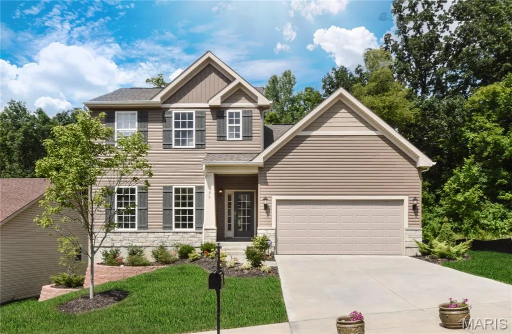 Craftsman house with stone siding, driveway, a shingled roof, and a front lawn — 1 TBB Sienna @ Kreder Farms, St Charles, MO 63304