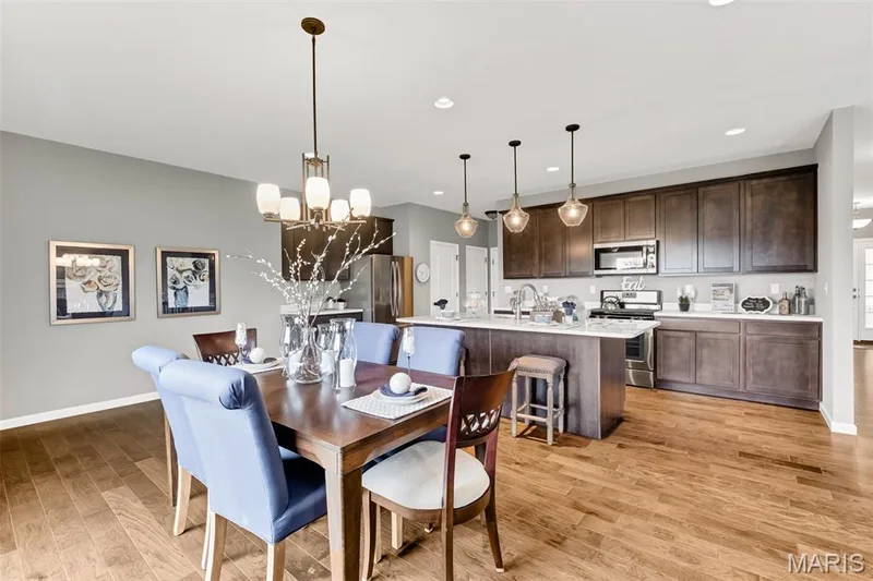 Dining area featuring a chandelier, recessed lighting, and light wood-style flooring — 1 TBB Sienna @ Kreder Farms, St Charles, MO 63304