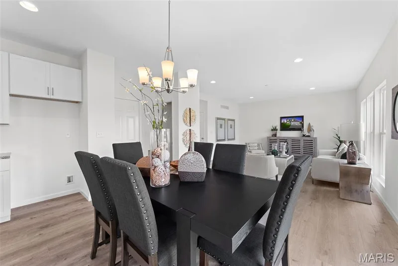 Dining room with recessed lighting, light wood-style floors, and a chandelier — 1 TBB Barkley @ Kreder Farms, St Charles, MO 63304