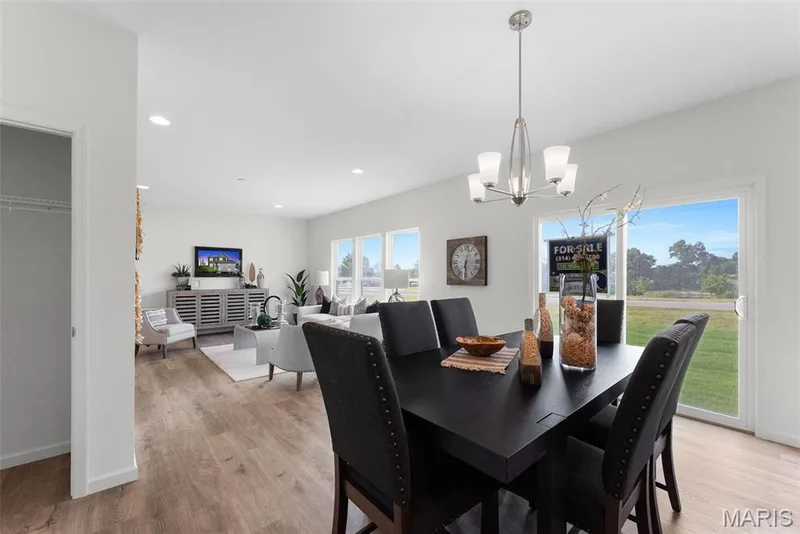 Dining space with light wood-type flooring, recessed lighting, and a chandelier — 1 TBB Barkley @ Kreder Farms, St Charles, MO 63304