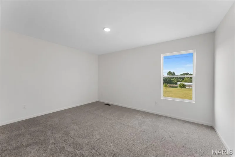 Unfurnished room featuring baseboards and light carpet — 1 TBB Barkley @ Kreder Farms, St Charles, MO 63304