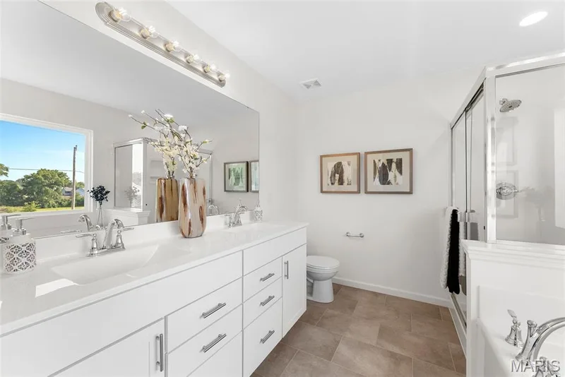 Bathroom with a garden tub, double vanity, and a shower stall — 1 TBB Barkley @ Kreder Farms, St Charles, MO 63304