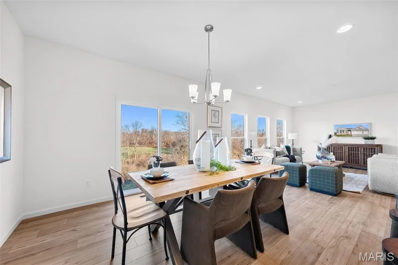 Dining area with light wood finished floors, recessed lighting, and a chandelier — 1 TBB Westbrook @ Kreder Farms, St Charles, MO 63304