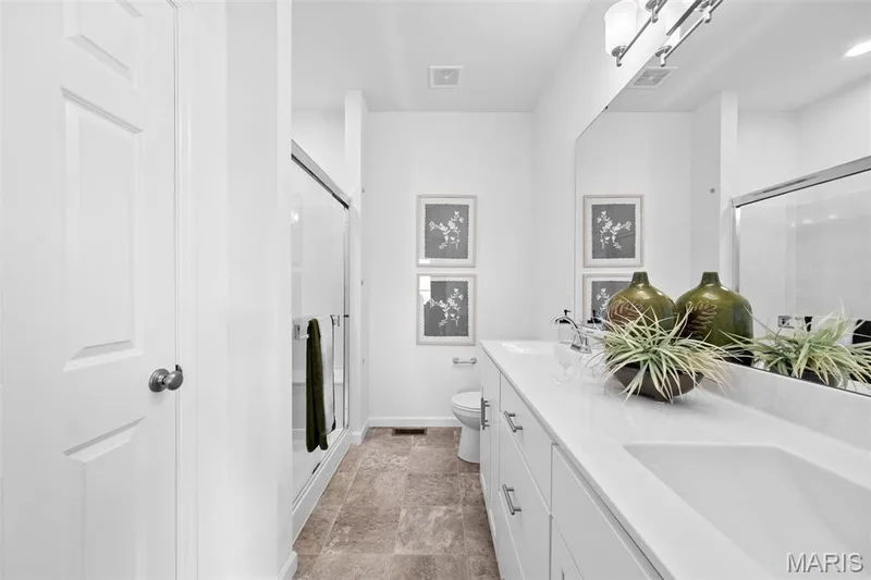 Full bath featuring a stall shower and double vanity — 1 TBB Westbrook @ Kreder Farms, St Charles, MO 63304