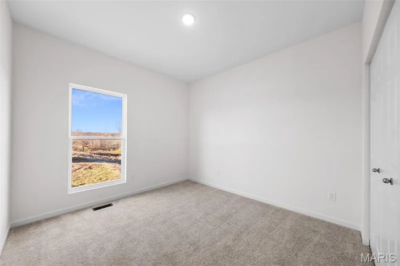 Carpeted spare room featuring baseboards — 1 TBB Westbrook @ Kreder Farms, St Charles, MO 63304