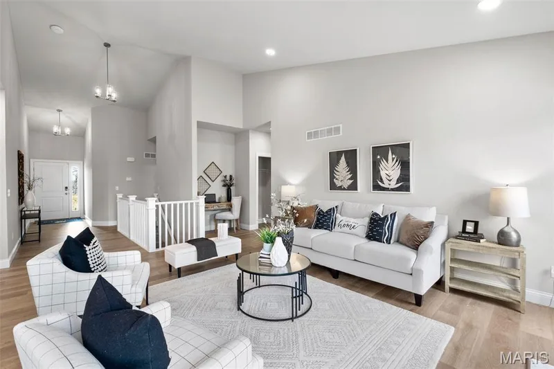 Living area featuring light wood-type flooring, high vaulted ceiling, a chandelier, and recessed lighting — 1 TBB Rockport @ Kreder Farms, St Charles, MO 63304