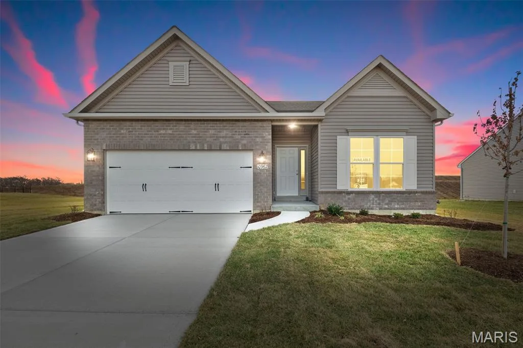 Ranch-style house featuring brick siding, concrete driveway, and a front yard — 1 TBB Savoy @ Kreder Farms, St Charles, MO 63304