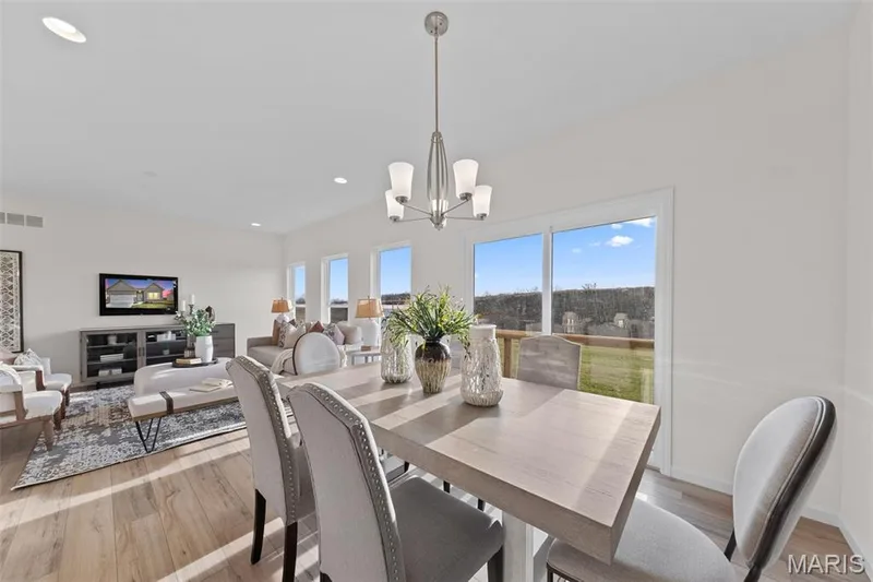 Dining space with light wood finished floors, recessed lighting, and a chandelier — 1 TBB Savoy @ Kreder Farms, St Charles, MO 63304