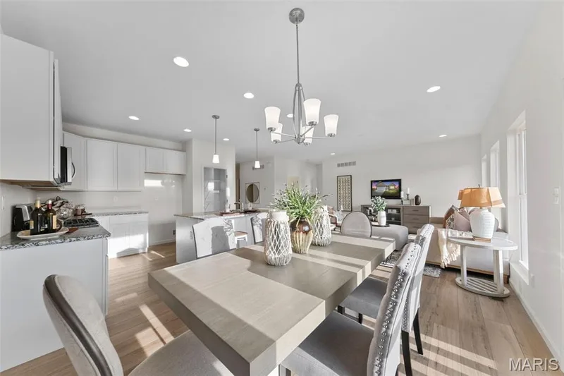 Dining space featuring light wood-style floors, recessed lighting, and a chandelier — 1 TBB Savoy @ Kreder Farms, St Charles, MO 63304