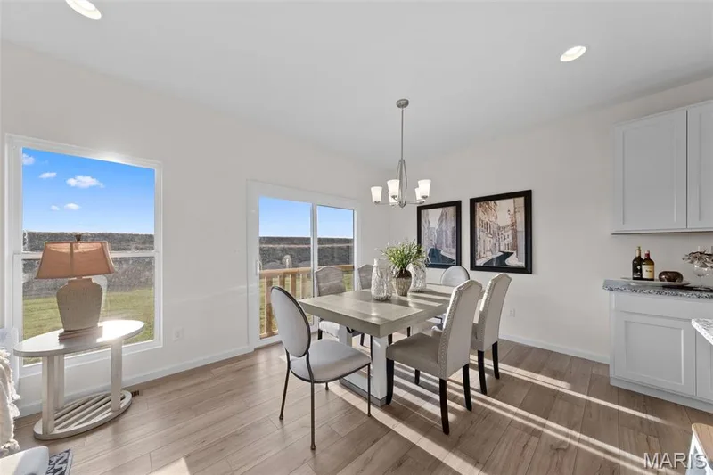 Dining area featuring recessed lighting, light wood finished floors, and a chandelier — 1 TBB Savoy @ Kreder Farms, St Charles, MO 63304