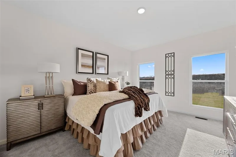 Bedroom with baseboards and light carpet — 1 TBB Savoy @ Kreder Farms, St Charles, MO 63304