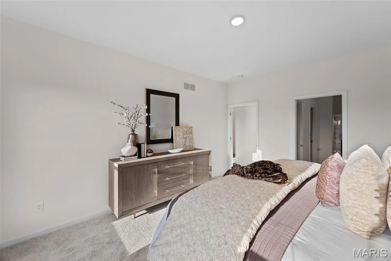 Bedroom featuring baseboards and carpet flooring — 1 TBB Savoy @ Kreder Farms, St Charles, MO 63304