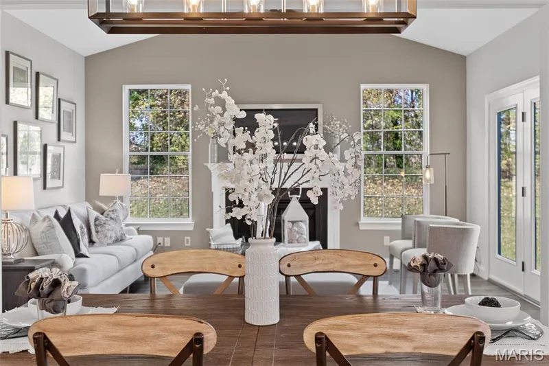 Sitting room featuring lofted ceiling and wood finished floors — 1 TBB Kingston @ Kreder Farms, St Charles, MO 63304